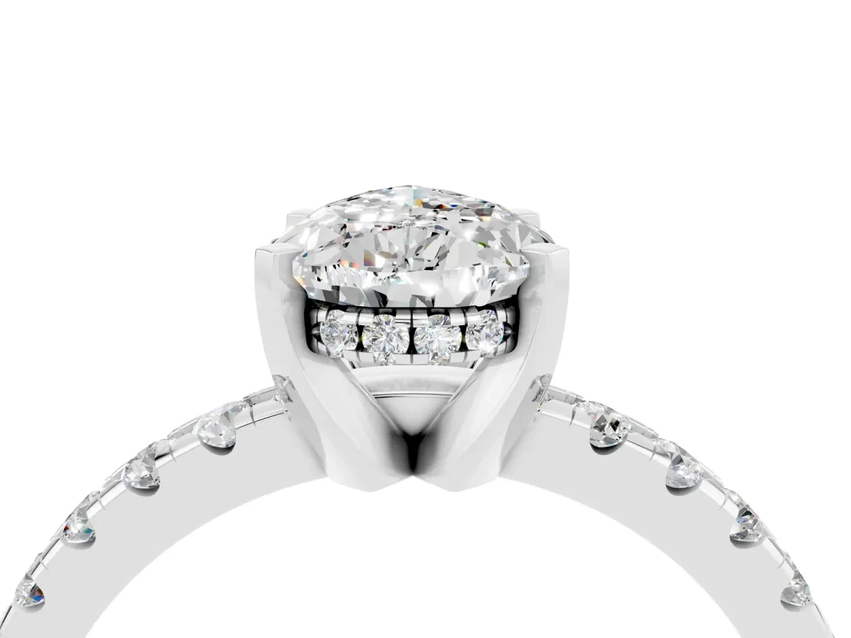 Pear Cut Moissanite Solitaire Ring with Round Pavé Band and Four-Prong Setting Silver