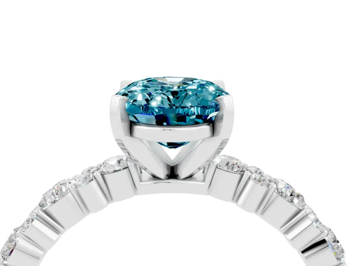 Oval Cut Blue Topaz Side Stone Solitaire Ring with Round and Four-Prong Setting White gold