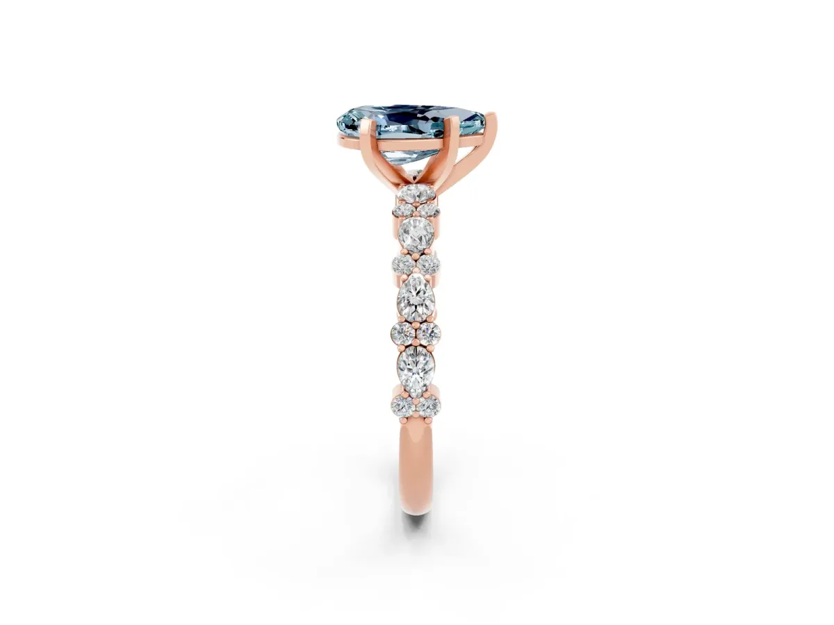 Pear Cut Aquamarine Side Stone Solitaire Ring with Round and Four-Prong Setting Rose gold