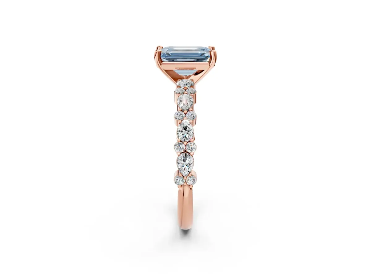 Fancy Blue Emerald Cut Diamond Side Stone Solitaire Ring with Round and Four-Prong Setting Rose gold