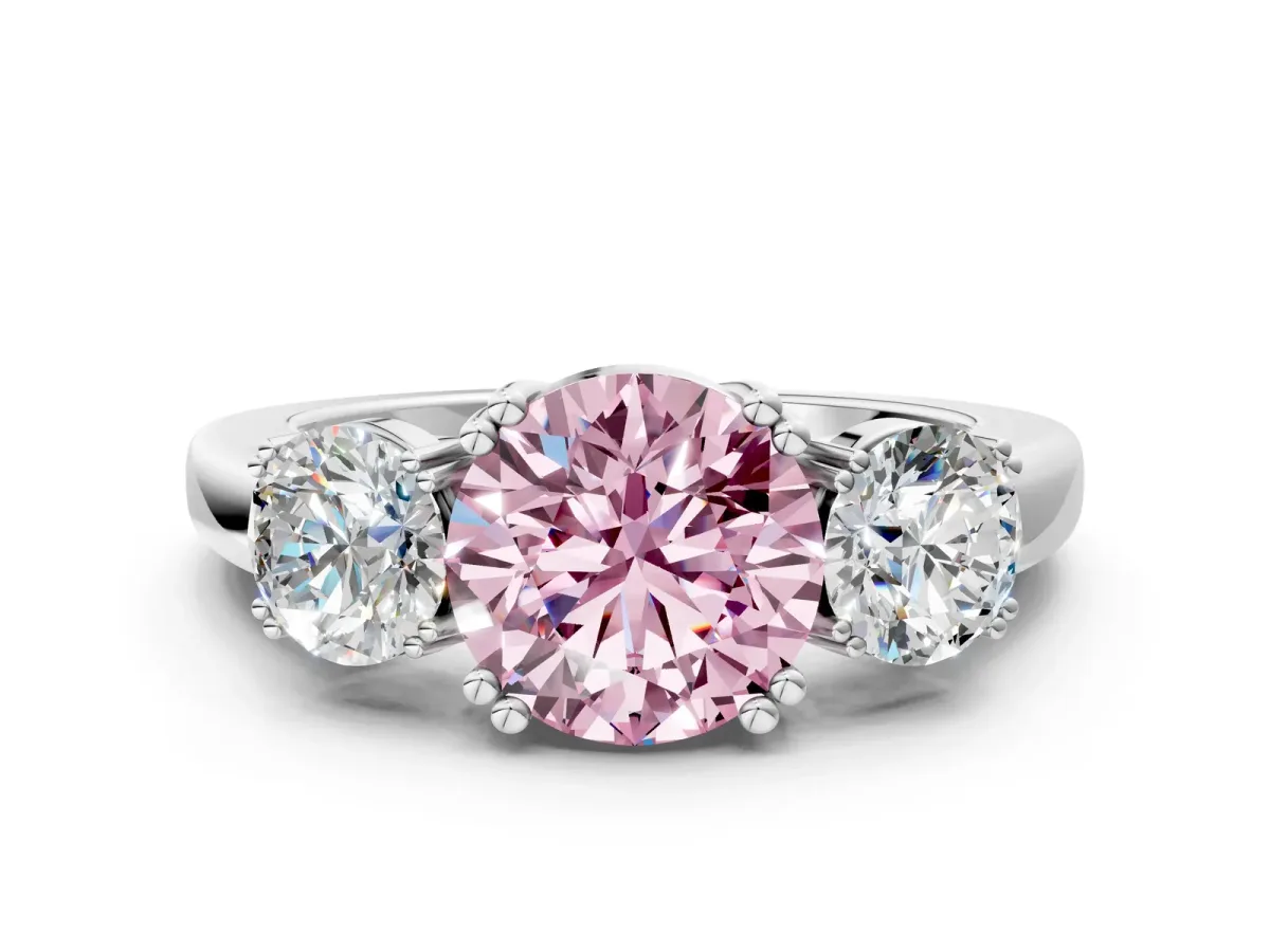 Fancy Pink Three-Stone Round Cut Cut Diamond Ring with Channel Set Band and Four-Prong Setting Silver