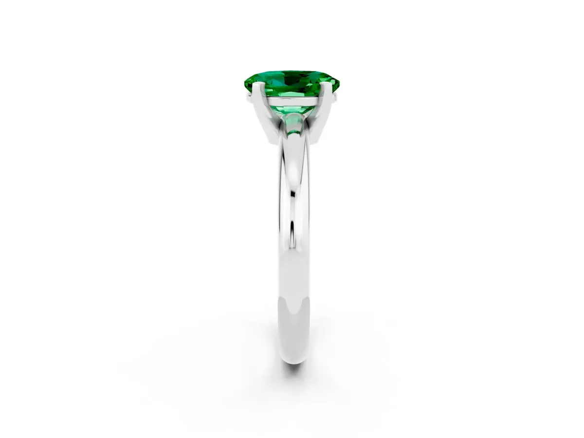 Oval Cut Emerald Solitaire Engagement Ring with Round Band and Four-Prong Setting Silver