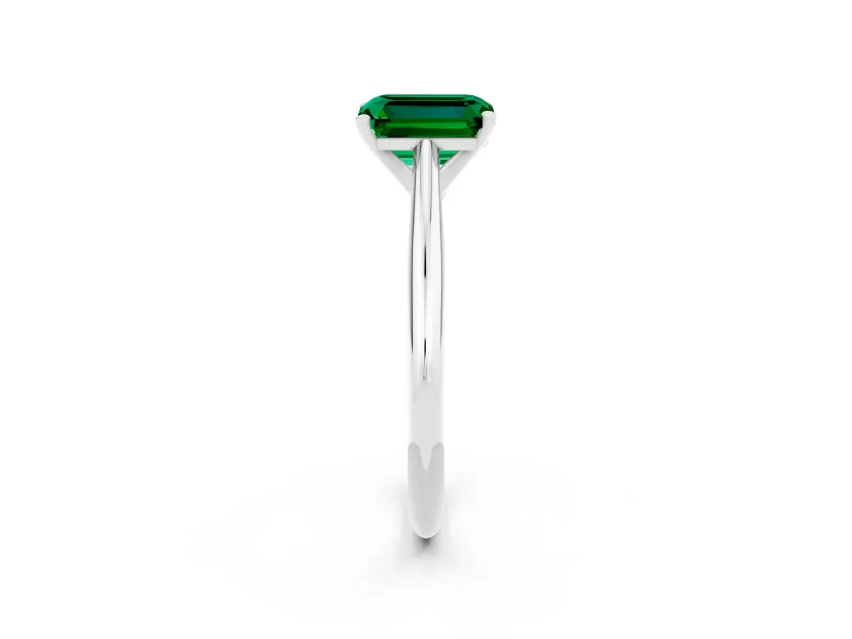 Emerald Cut Emerald Solitaire Engagement Ring with Cathedral Setting and Four-Prong Mount White gold