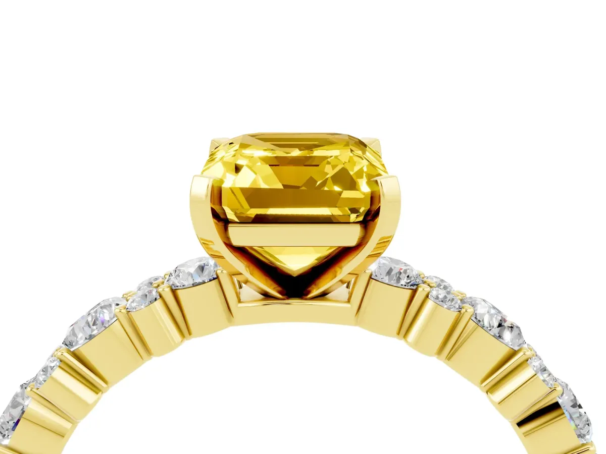 Emerald Cut Yellow Sapphire Side Stone Solitaire Ring with Round and Four-Prong Setting Yellow gold