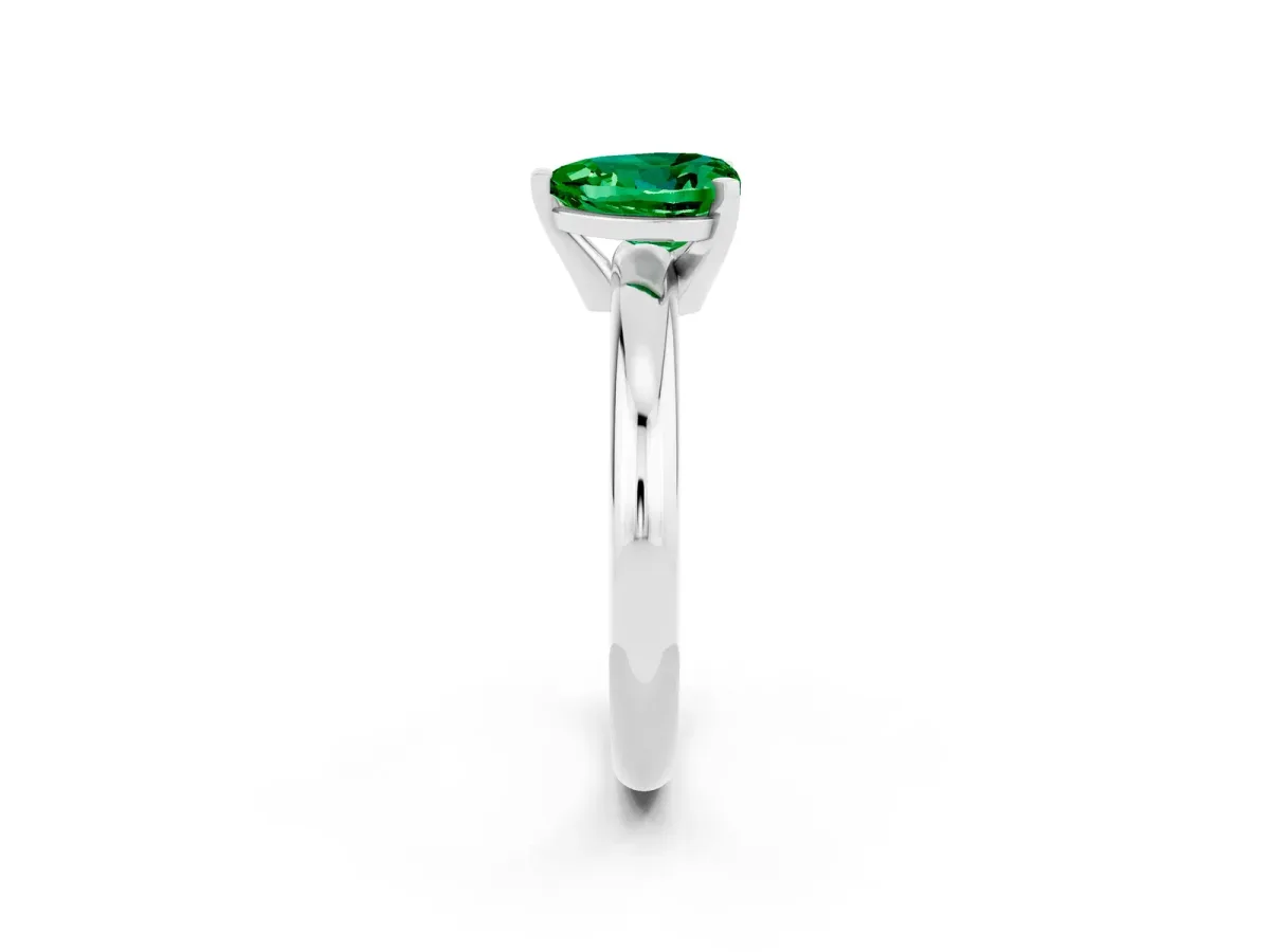 Heart Cut Emerald Solitaire Engagement Ring with Round Band and Four-Prong Setting Silver
