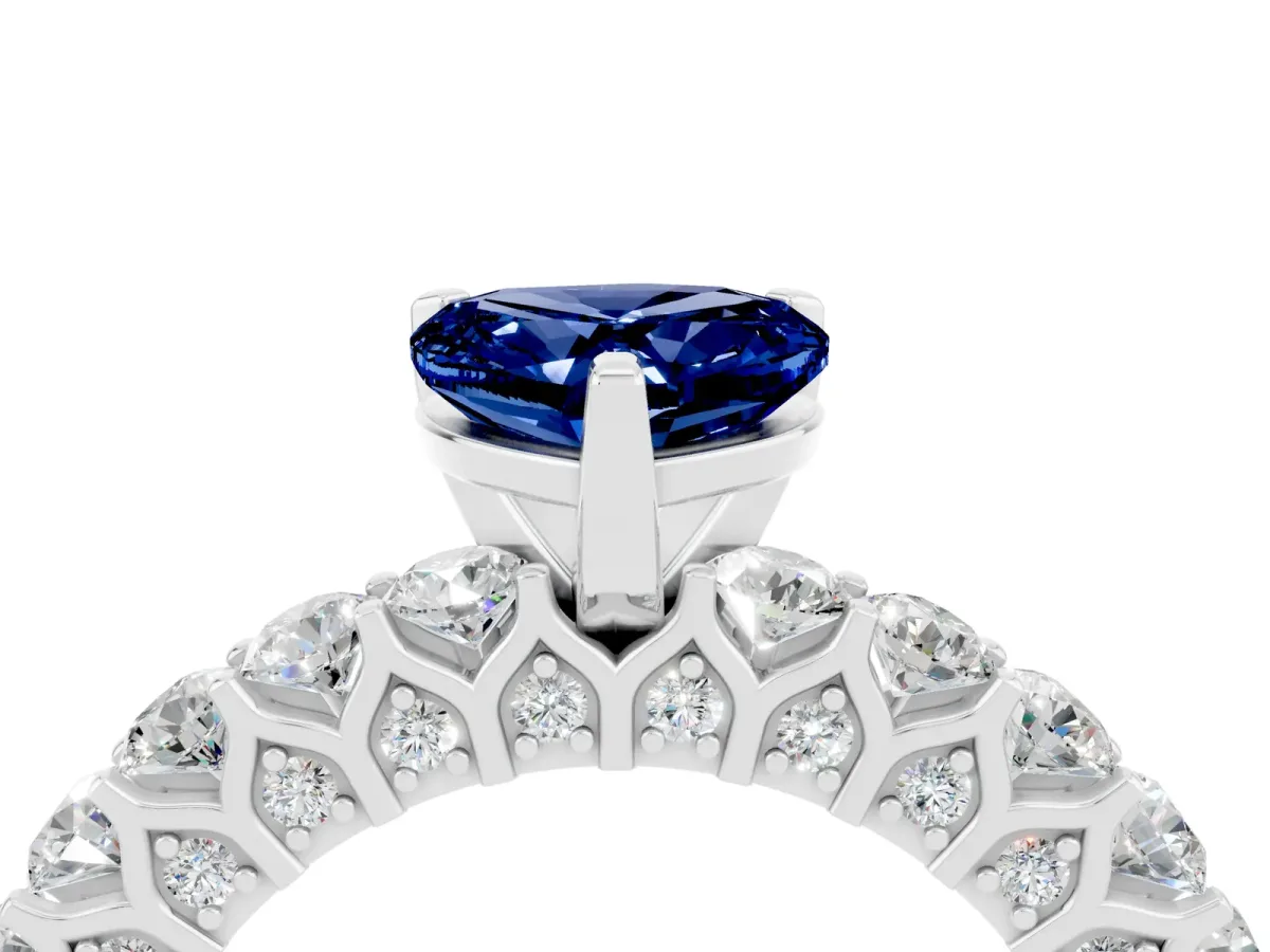 Heart Cut Blue Sapphire Solitaire Ring with Shared Prong Pavé Band and Four-Prong Setting Silver