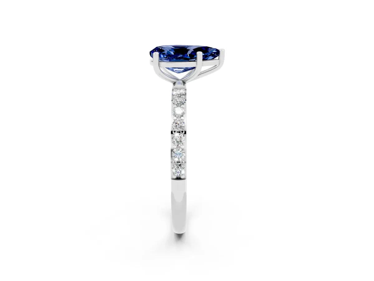 Pear Cut Blue Sapphire Solitaire Ring with Round Pavé Band and Prong Setting Platinum