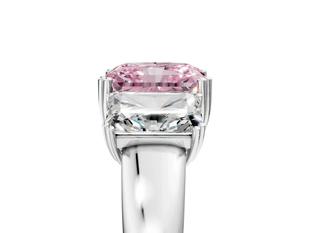 Fancy Pink Three-Stone Radiant Cut Cut Diamond Ring with Channel Set Band and Four-Prong Setting Silver