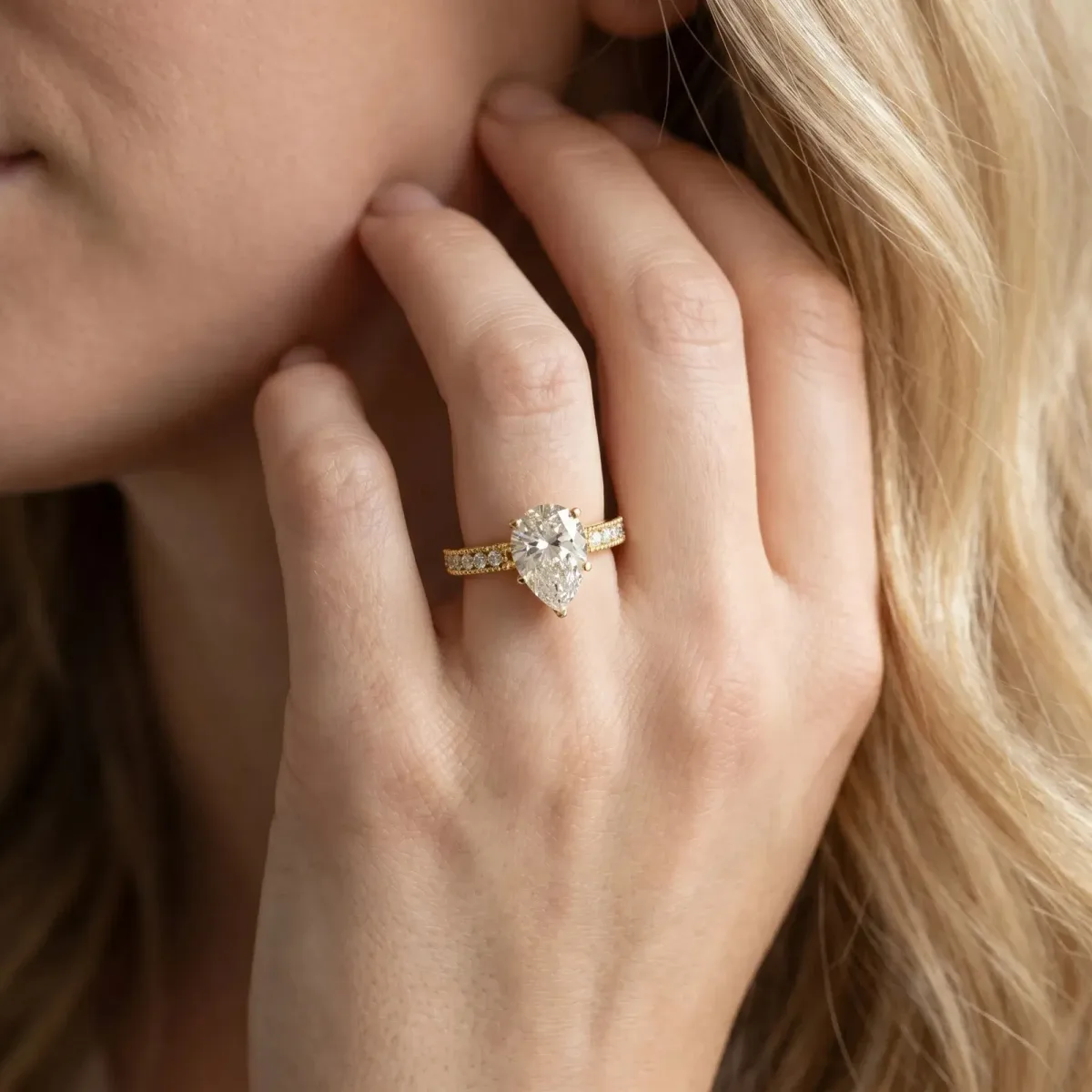 Pear Cut Solitaire with Pavé Band and Four-Prong Setting Yellow gold