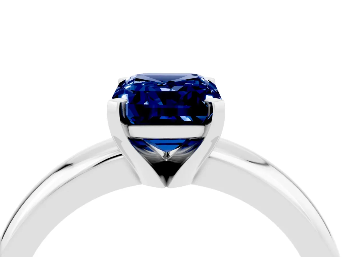 Emerald Cut Blue Sapphire Solitaire Engagement Ring with Round Band and Four-Prong Setting Silver