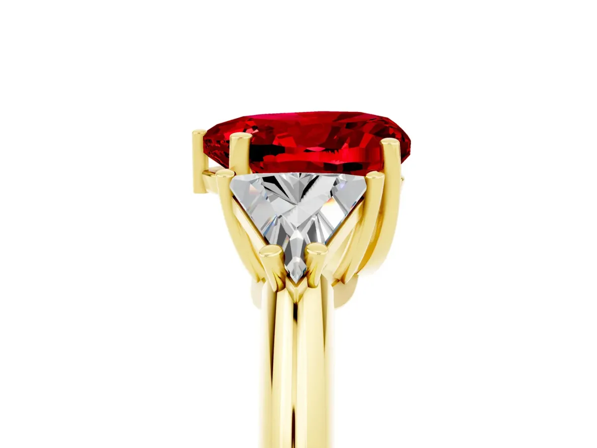 Three-Stone Heart Cut Ruby Engagement Ring with Trillion Side Stones and Prong Setting Yellow gold