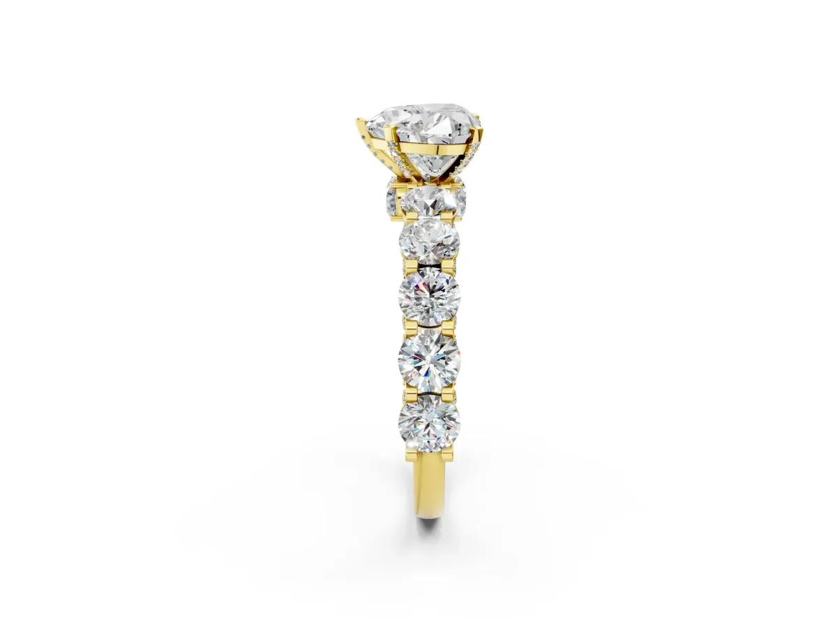 Heart Cut Diamond Side Stone Engagement Ring with Four-Prong Setting Yellow gold
