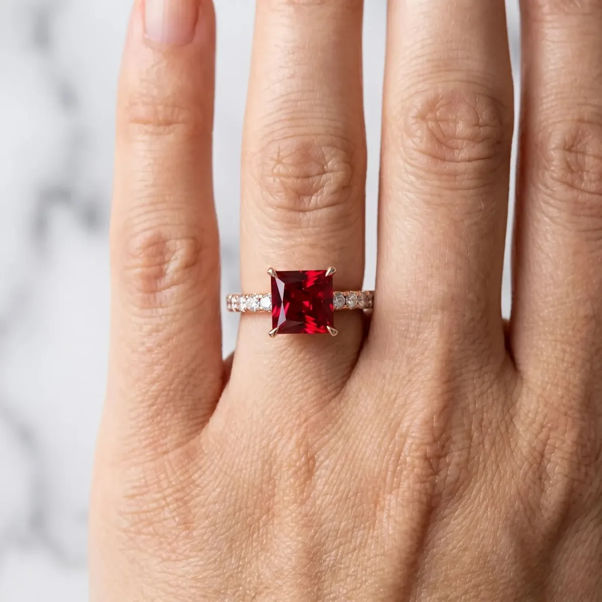 Princess Cut Ruby Solitaire Ring with Round Pavé Band and Four-Prong Setting Rose gold