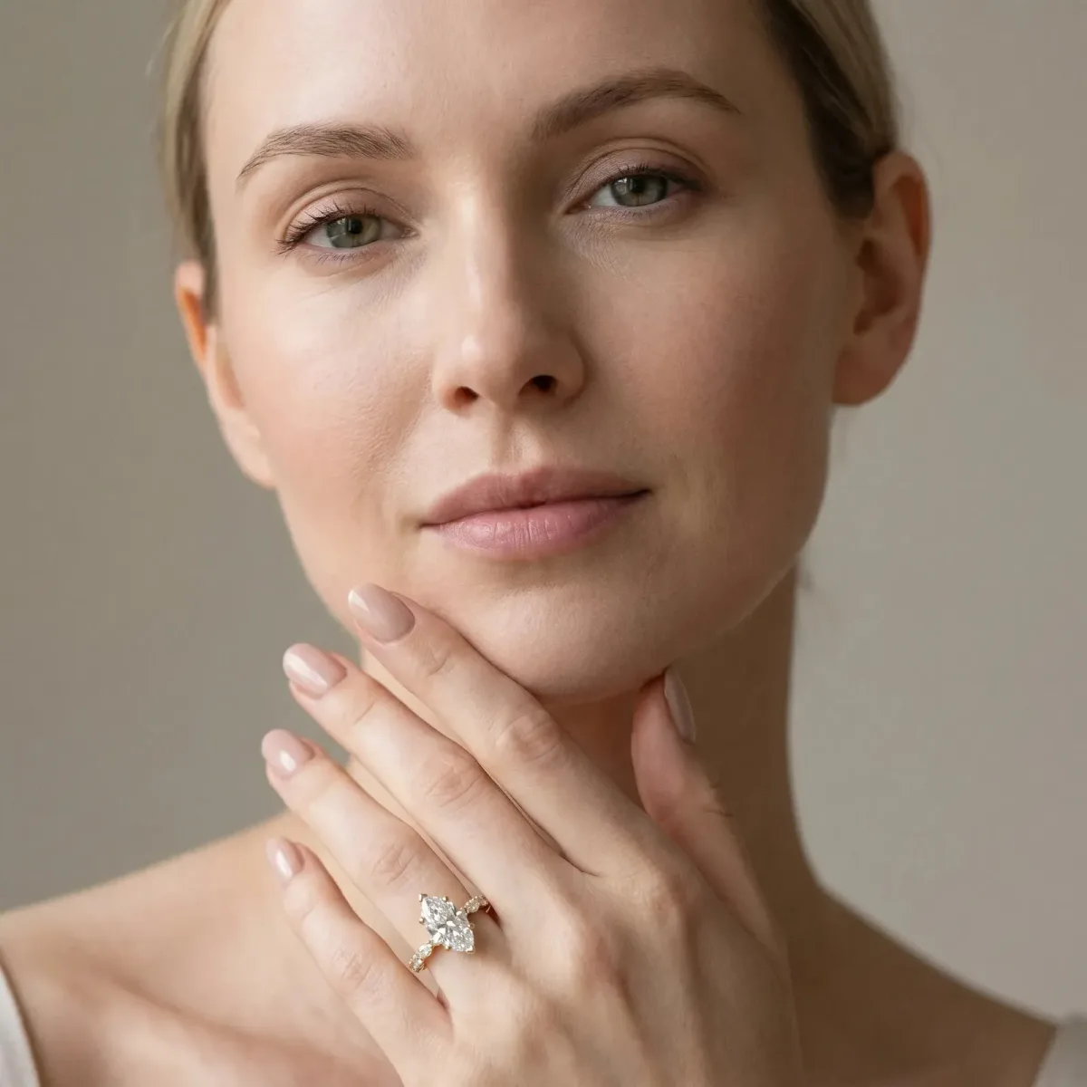 Marquise Cut Diamond Side Stone Solitaire Ring with Round and Four-Prong Setting Yellow gold
