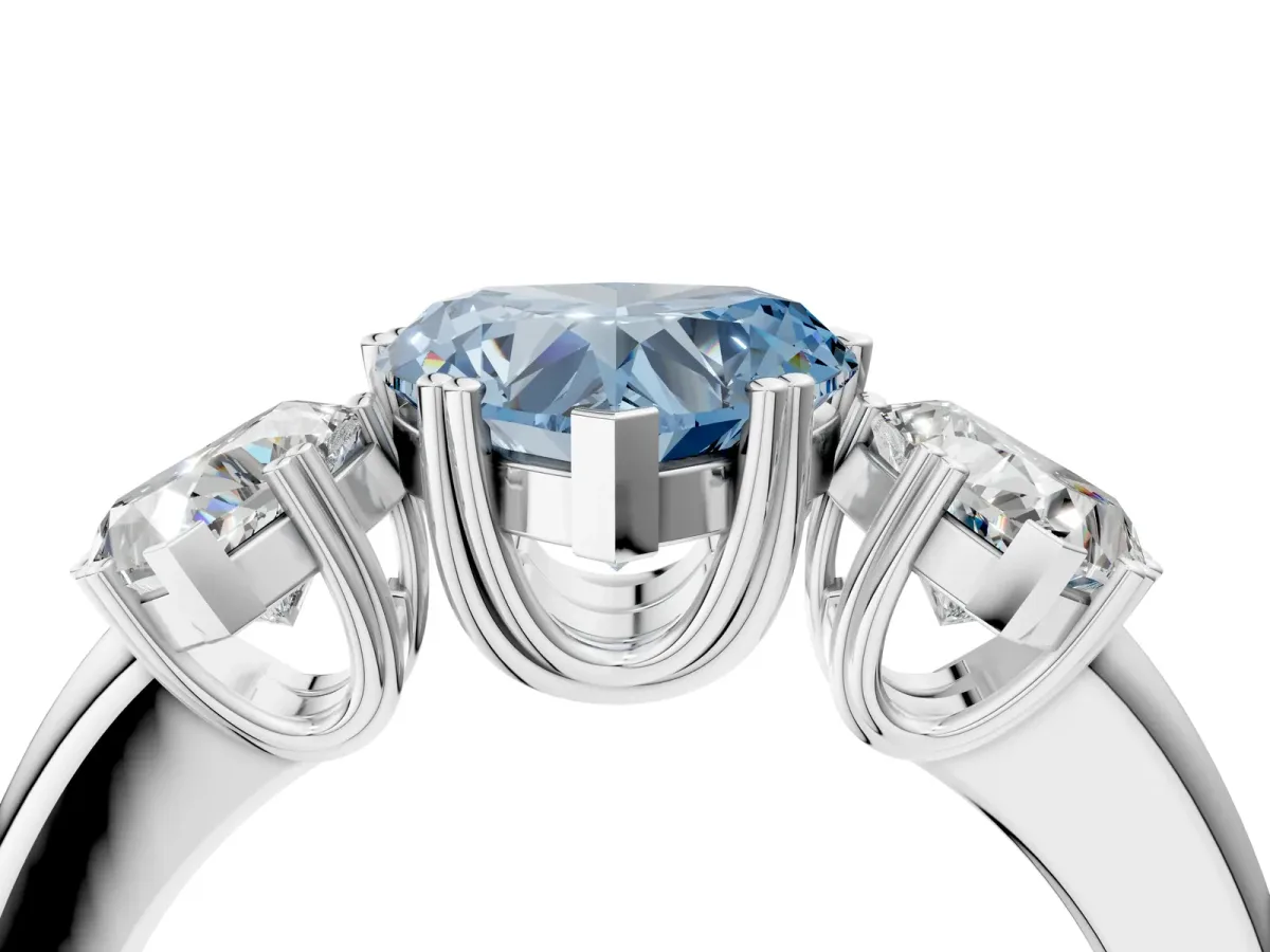 Fancy Blue Three-Stone Heart Cut Cut Diamond Ring with Channel Set Band and Four-Prong Setting Silver