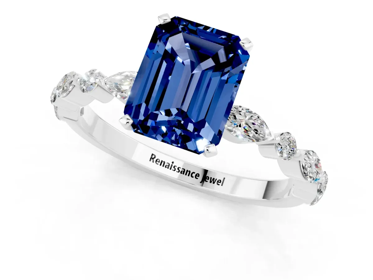 Emerald Cut Blue Sapphire Ring with Marquise and Round Side Stones and Four-Prong Setting Silver