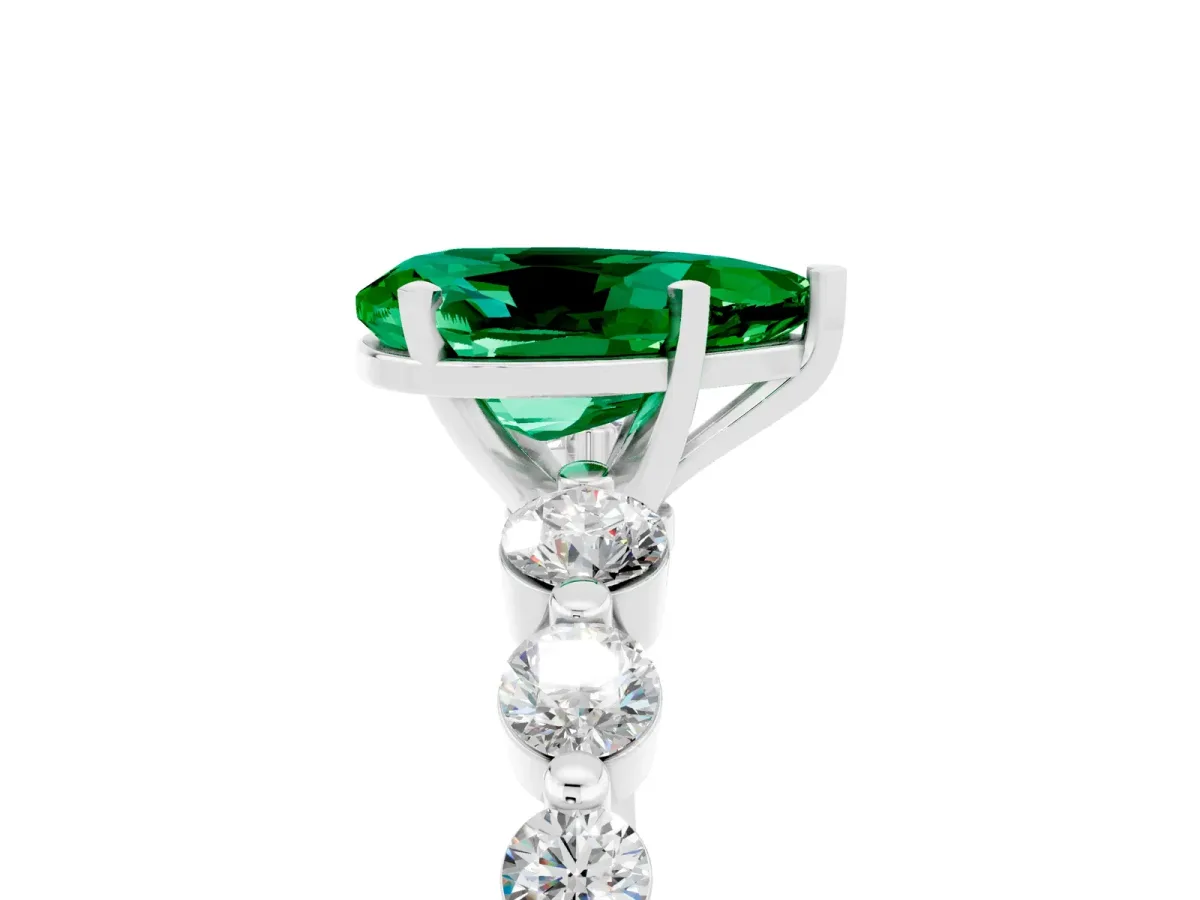 Pear Cut Solitaire Emerald Ring with Pave Band and Four-Prong Setting Silver