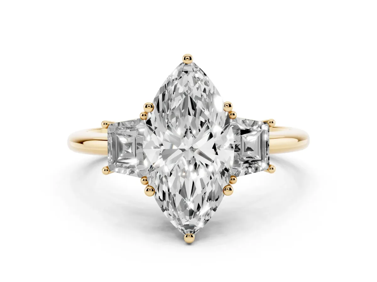 Marquise Cut Diamond Three-Stone Ring with Trapezoid Side Stones and Prong Setting Yellow gold