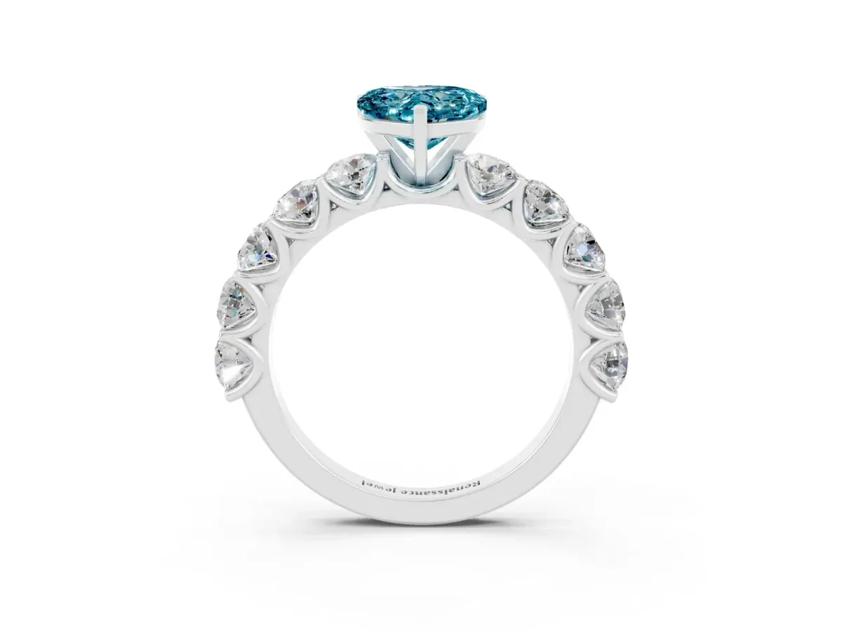 Heart Cut Blue Topaz Prong Setting with Side Stones on a Pave Band Silver