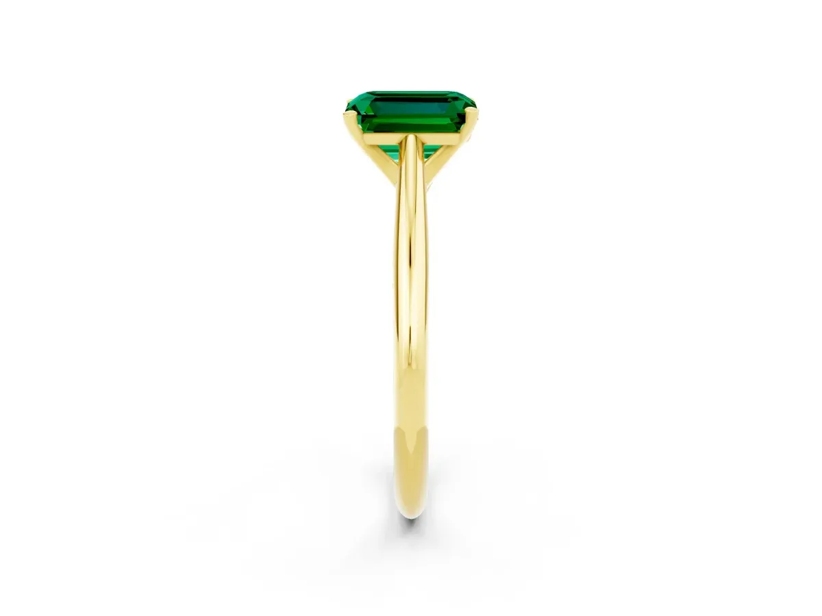 Emerald Cut Emerald Solitaire Engagement Ring with Cathedral Setting and Four-Prong Mount Yellow gold