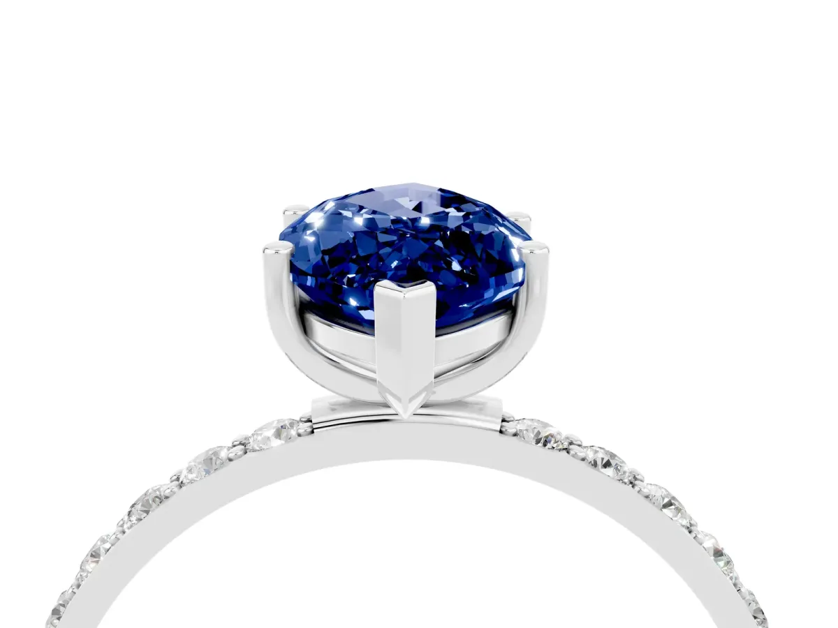 Marquise Cut Blue Sapphire Solitaire Ring with Round Pavé Band and Prong Setting Silver