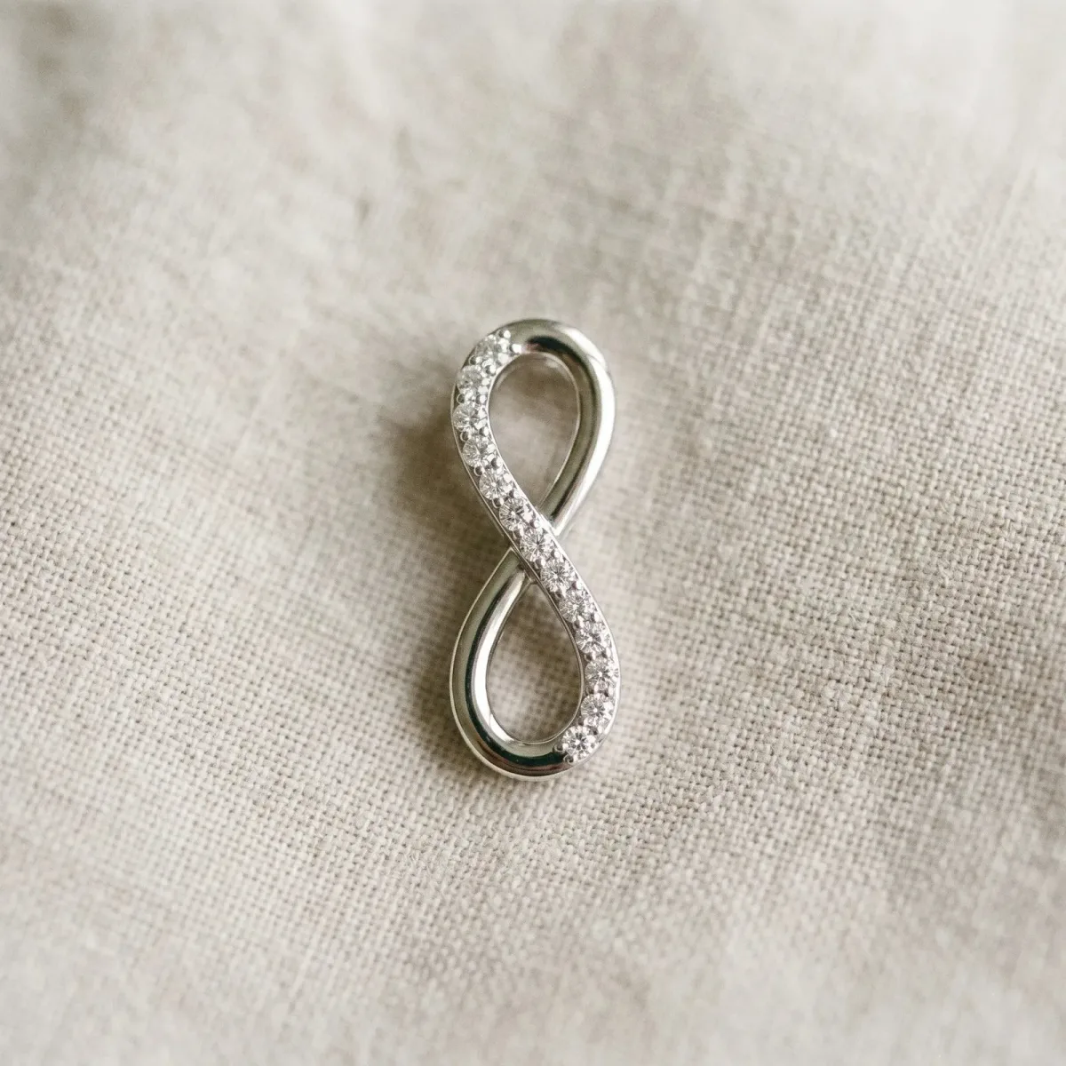 Infinity Pendant with Round Brilliant Diamonds in Pavé Setting White gold