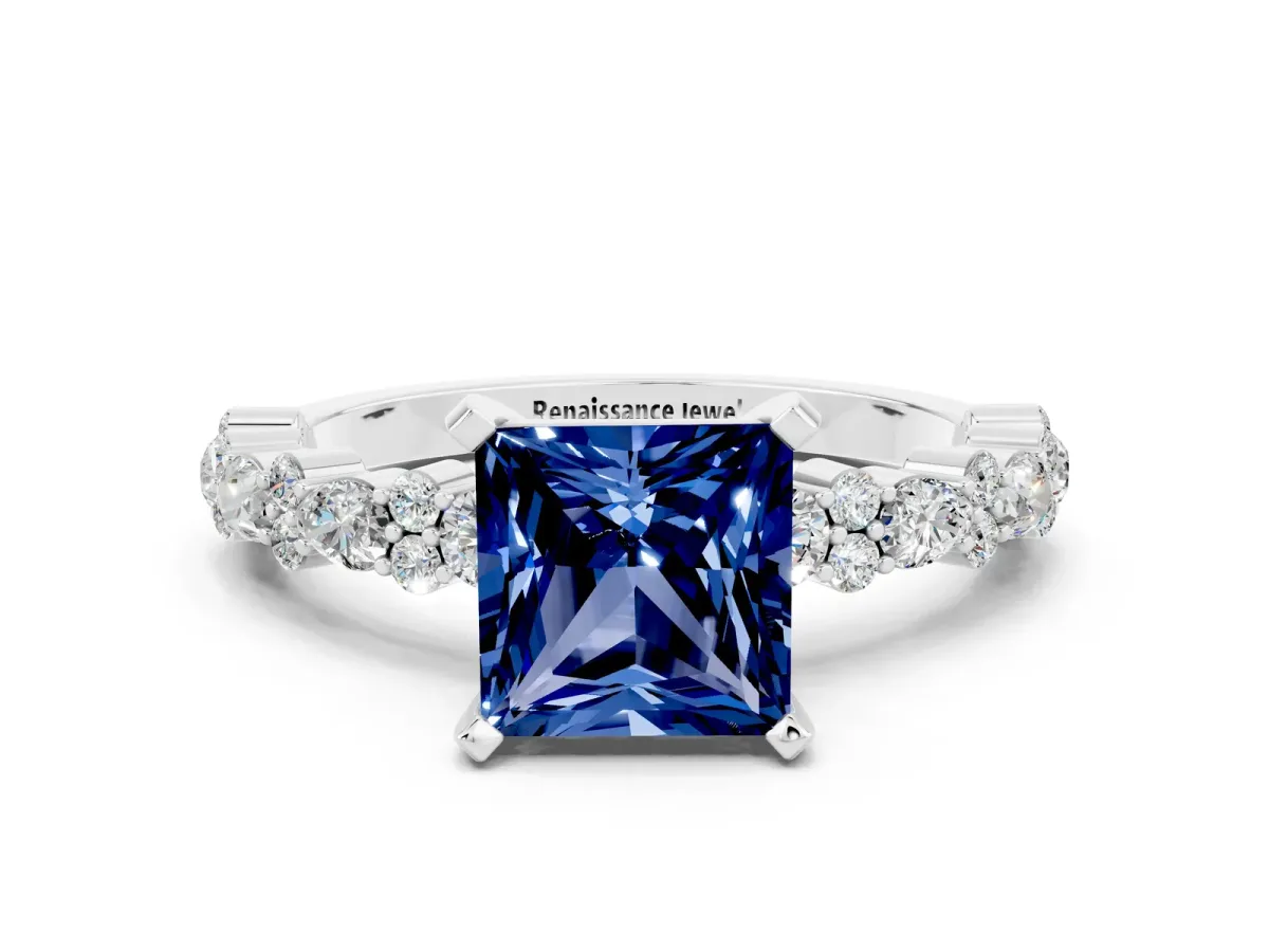 Princess Cut Blue Sapphire Side Stone Solitaire Ring with Round and Four-Prong Setting Platinum