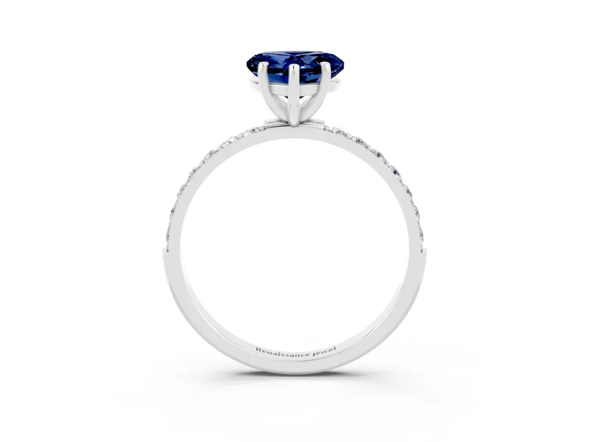 Heart Cut Blue Sapphire Solitaire Ring with Round Pavé Band and Prong Setting Silver