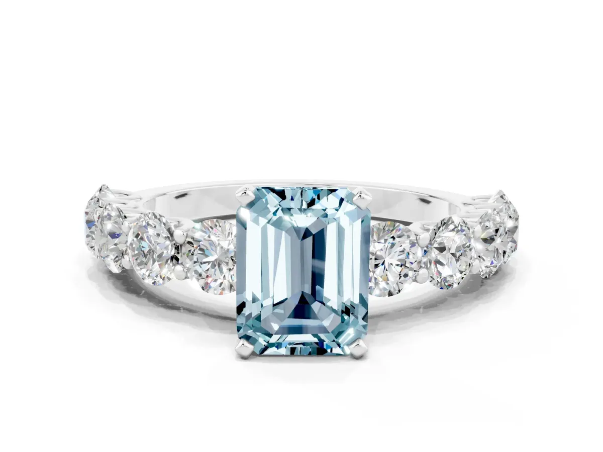 Emerald Cut Aquamarine Prong Setting with Side Stones on a Pave Band Silver
