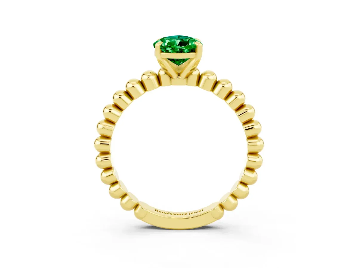 Pear Cut Emerald Solitaire Ring with Beaded Band and Prong Setting Yellow gold