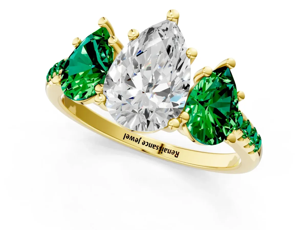 Three-Stone Pear Cut Diamond Ring with Round Emerald Pavé Band and Prong Setting Yellow gold