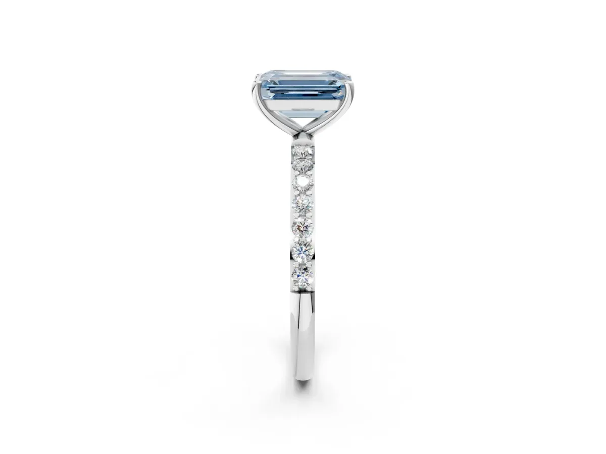 Fancy Blue Emerald Cut Diamond Solitaire Ring with Round Pavé Shoulders and Prong Setting Silver