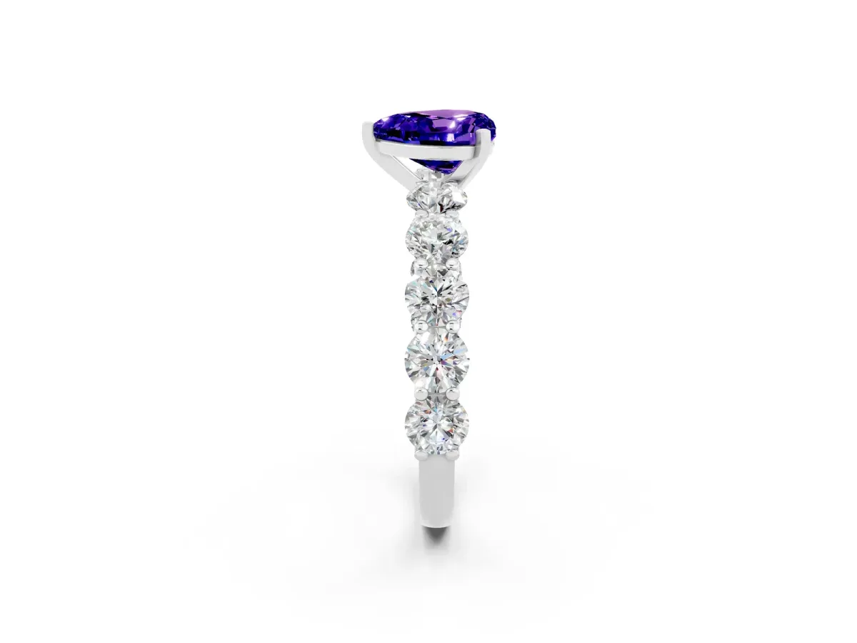 Heart Cut Tanzanite Prong Setting with Side Stones on a Pave Band Silver