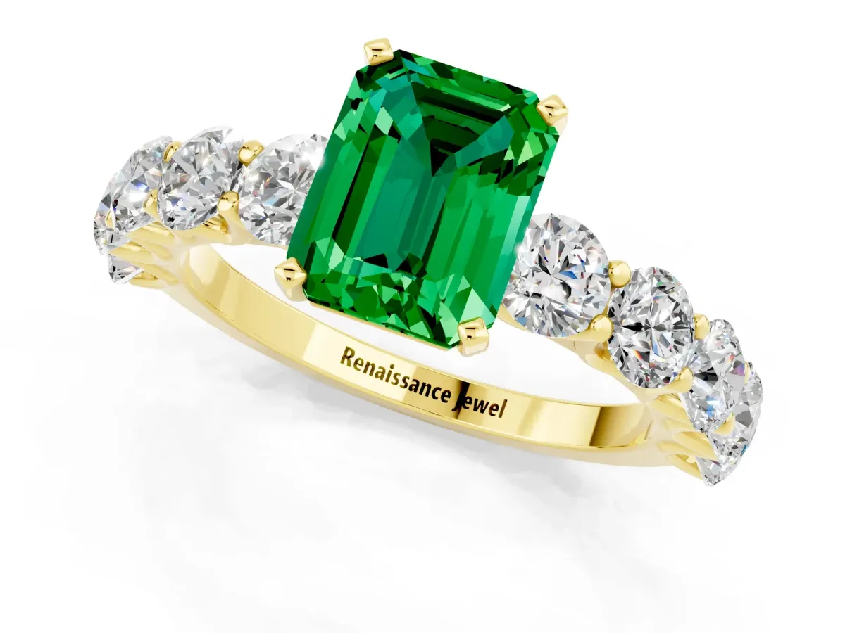Emerald Cut Emerald Prong Setting with Side Stones on a Pave Band Yellow gold