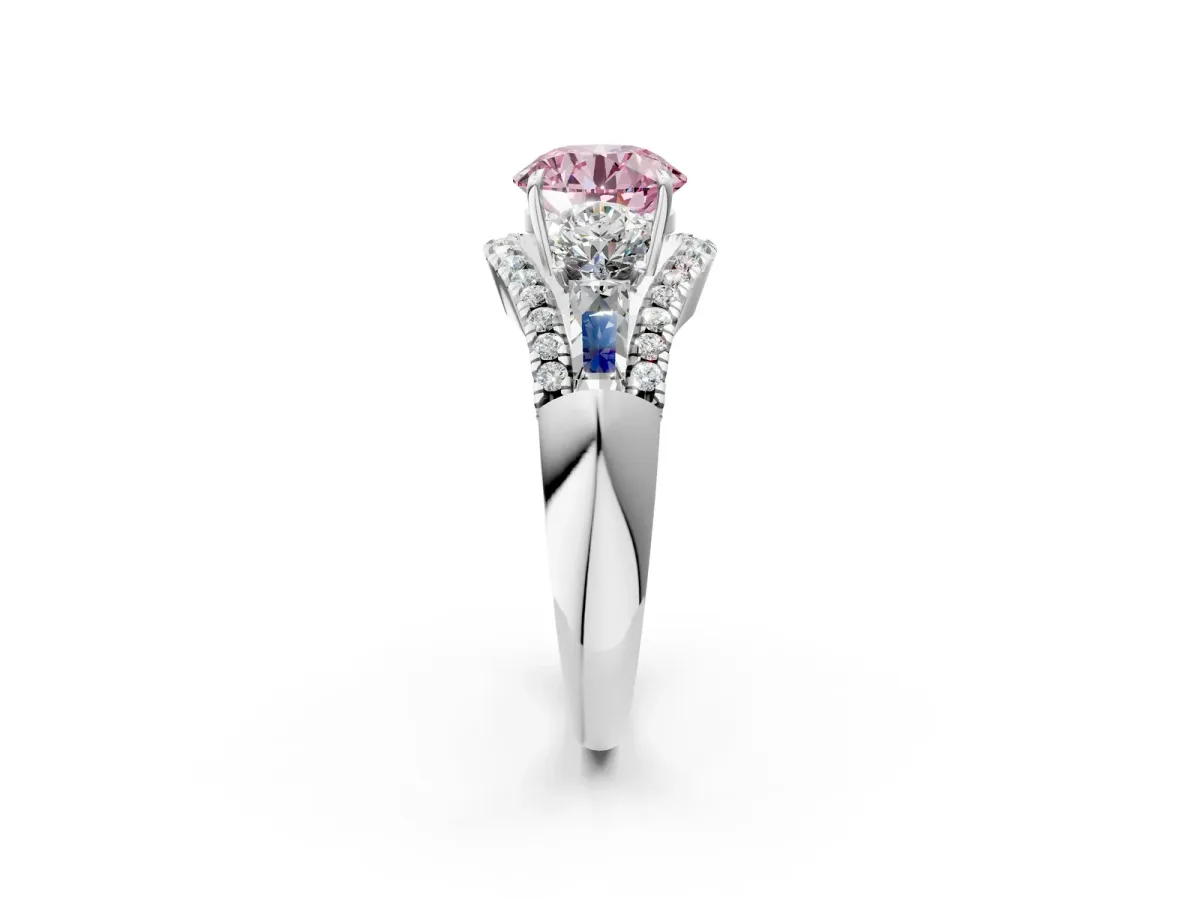 Fancy Pink Three-Stone Round Cut Diamond Engagement Ring with Pave Band and Prong Setting Platinum