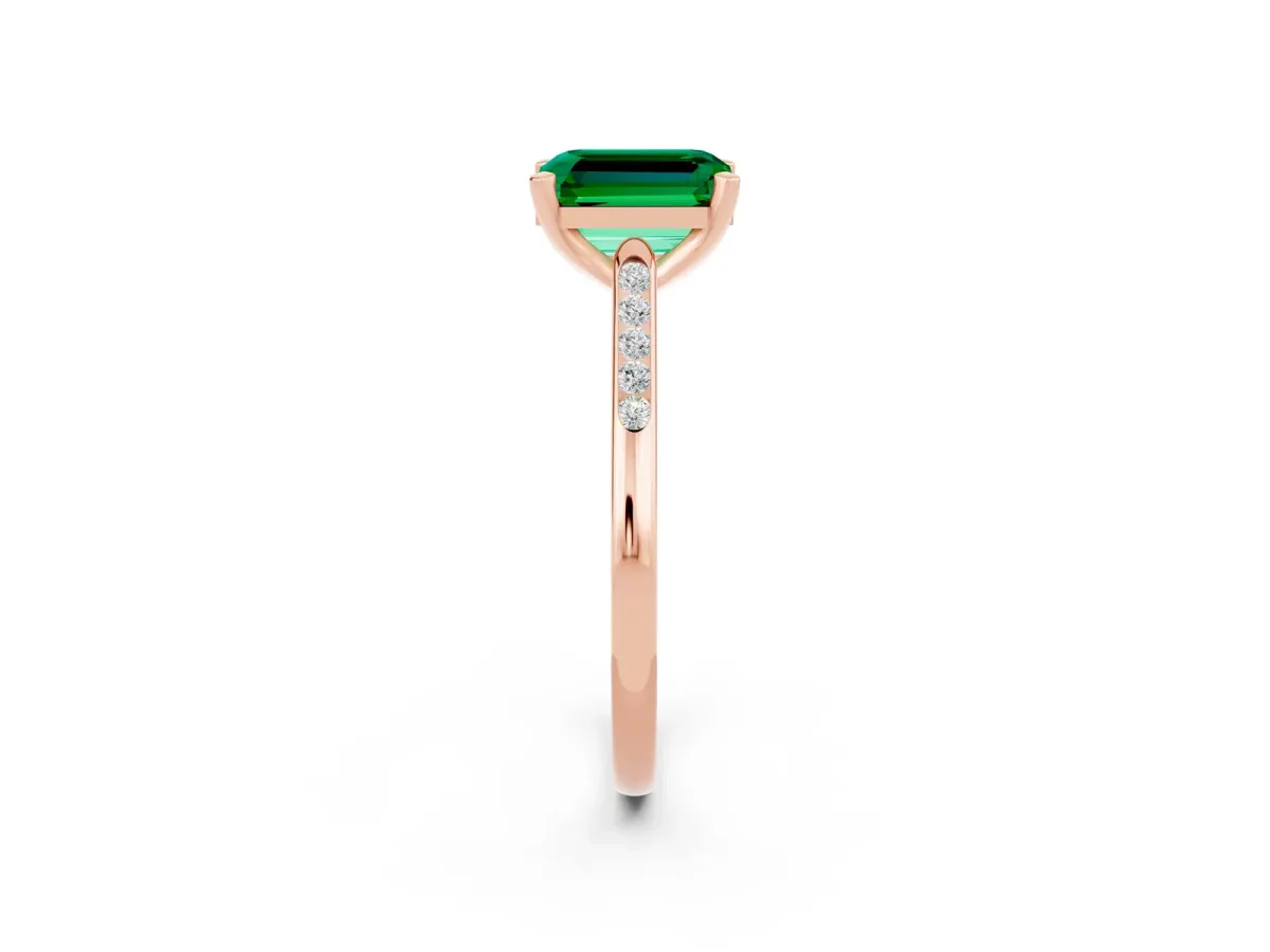 Emerald Cut Emerald Solitaire Ring with Channel Set Round Band and Prong Setting Rose gold