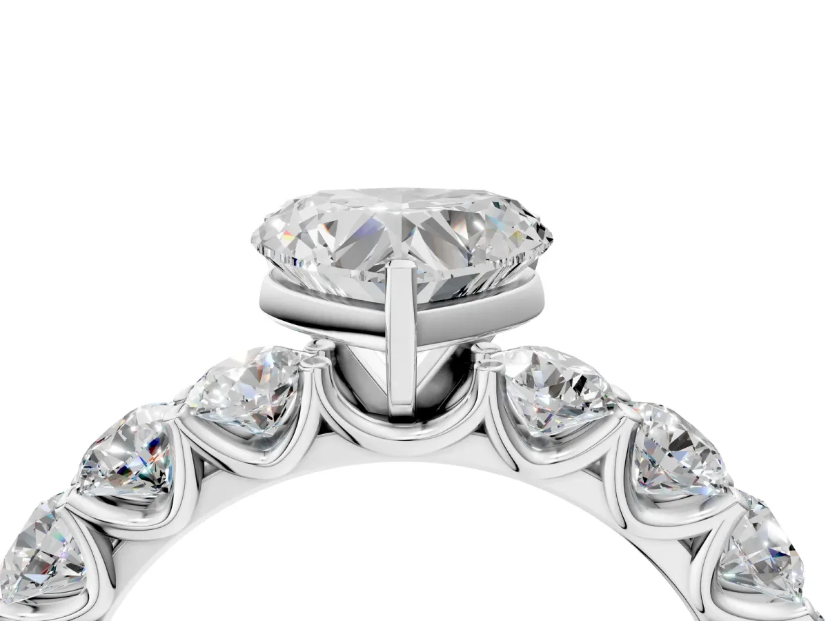 Heart Cut Diamond Prong Setting with Side Stones on a Pave Band Platinum