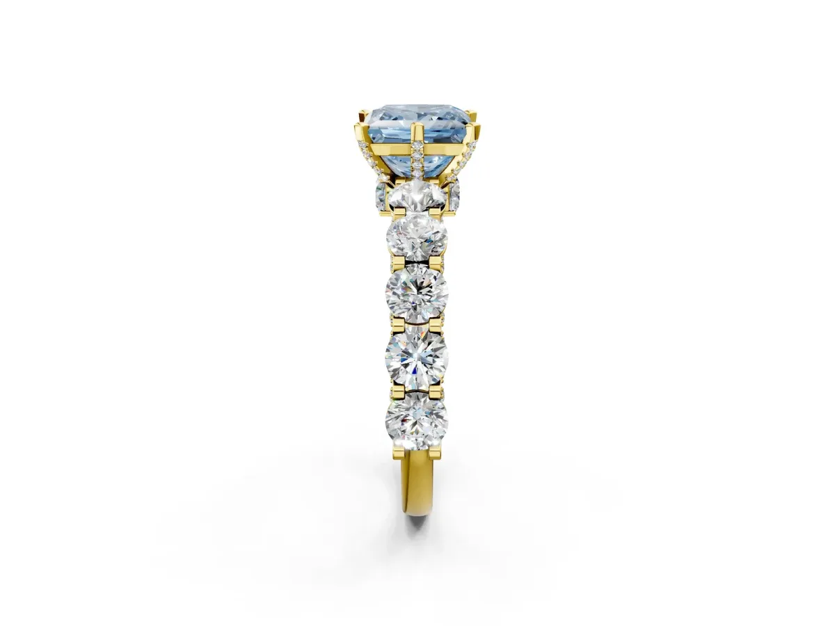 Fancy Blue Princess Cut Diamond Side Stone Engagement Ring with Four-Prong Setting Yellow gold