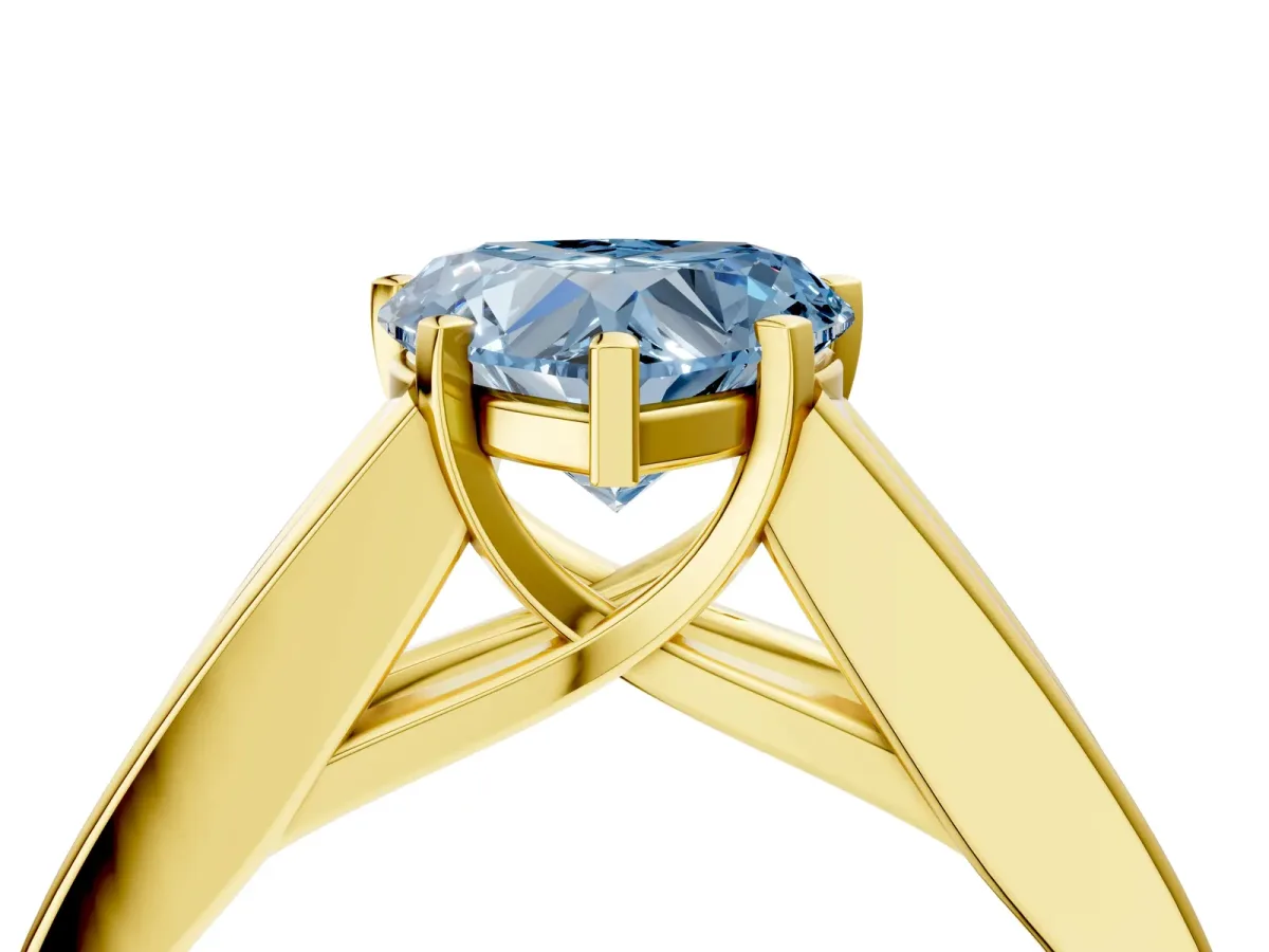 Fancy Blue Heart Cut Cut Channel Set Solitaire Ring with Four-Prong Setting Yellow gold
