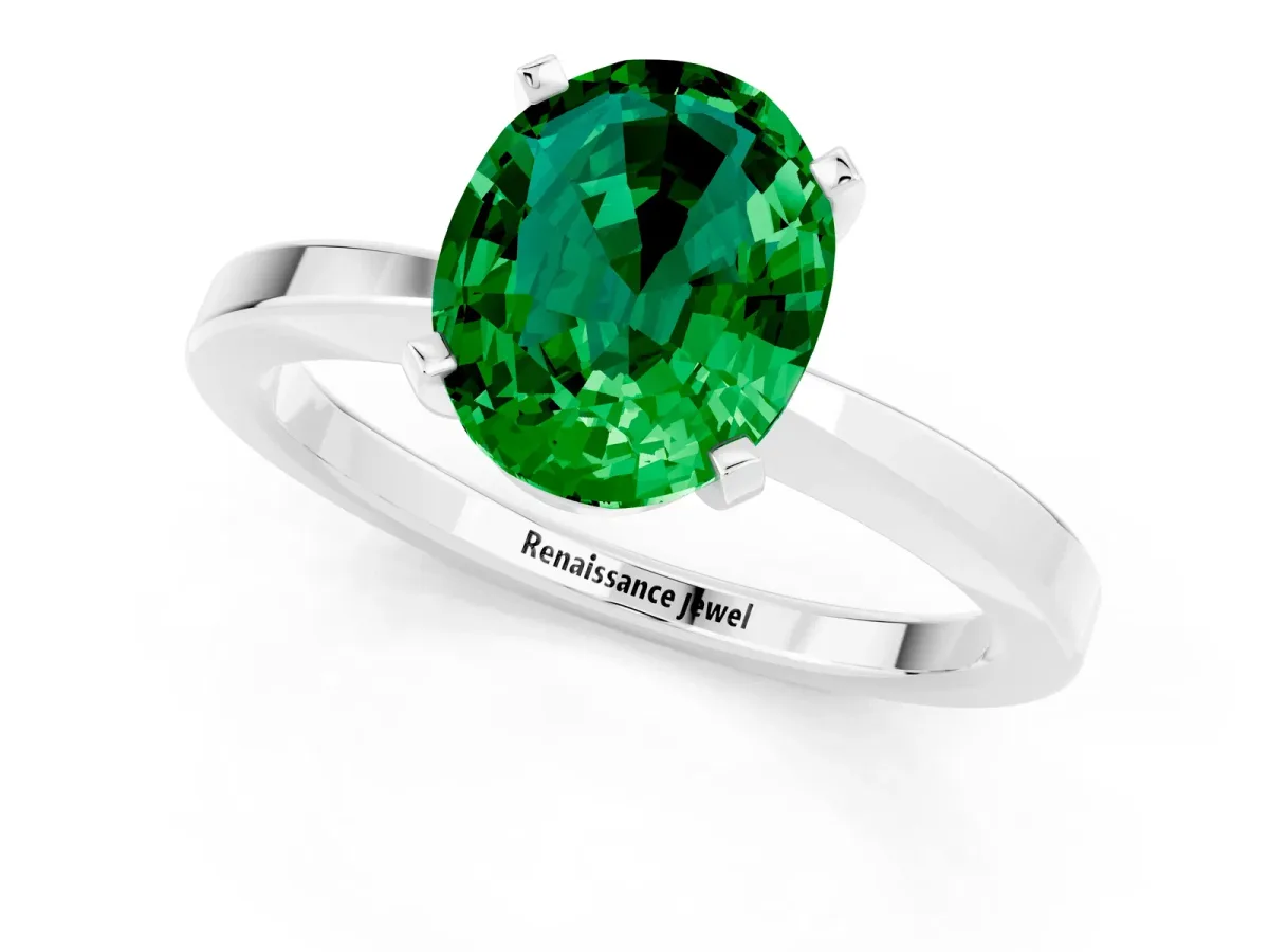 Oval Cut Emerald Solitaire Engagement Ring with Classic Band and Four-Prong Setting Silver