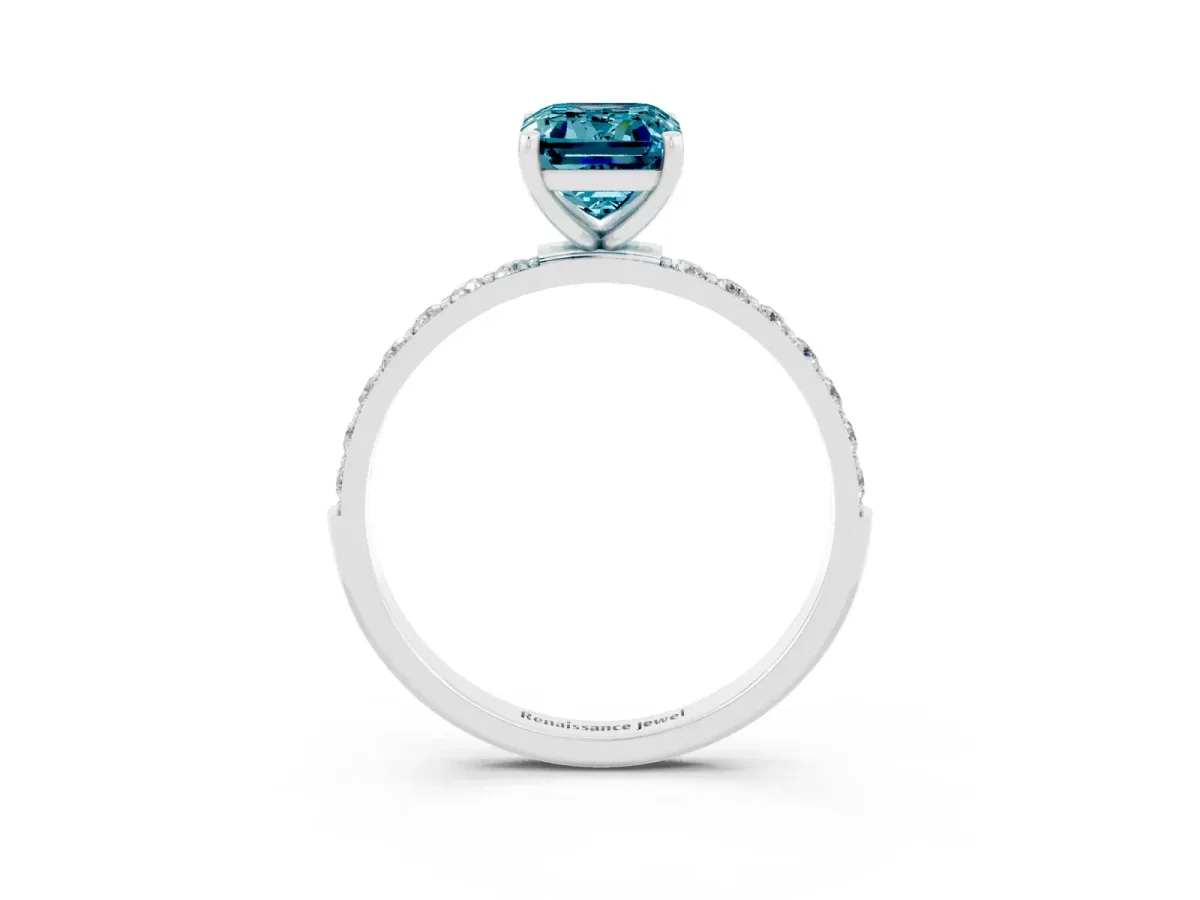 Emerald Cut Blue Topaz Solitaire Ring with Round Pavé Band and Prong Setting Platinum