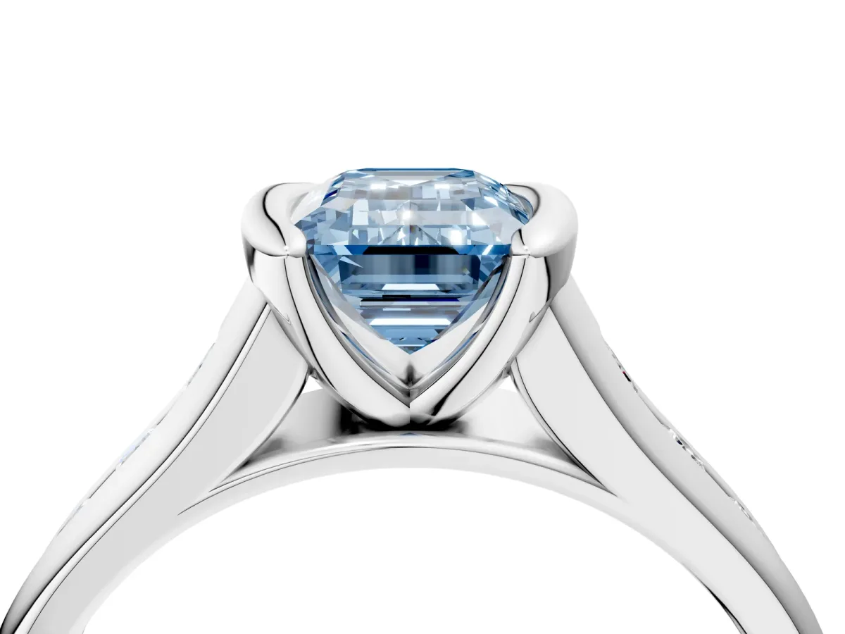 Fancy Blue Emerald Cut Solitaire Bezel-Set Diamond Ring with Channel-Set Band Platinum