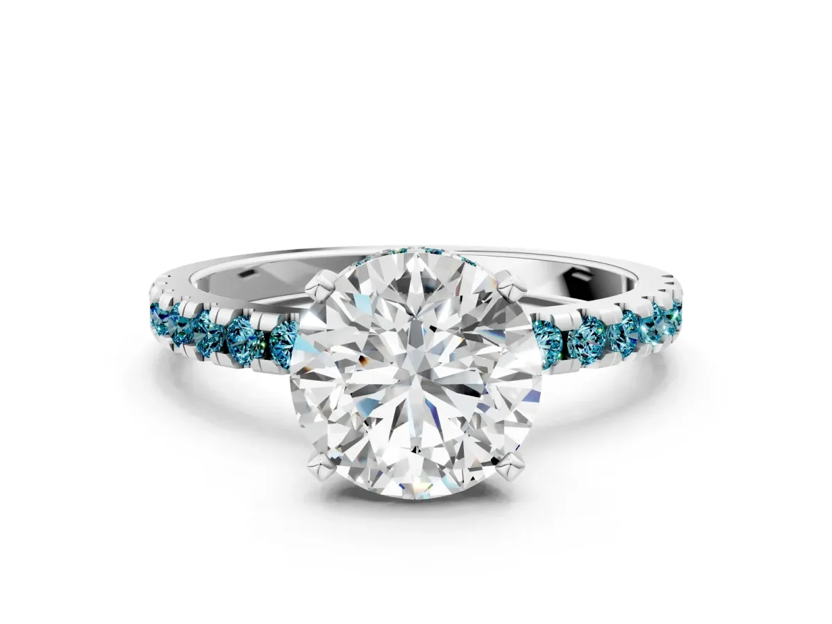 Round Cut Diamond Solitaire Ring with Round Tanzanite Pavé Band and Four-Prong Setting Silver