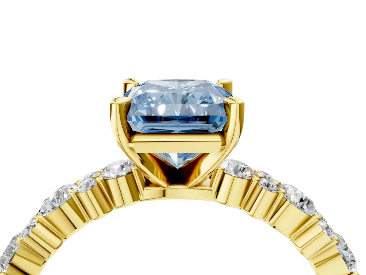Fancy Blue Radiant Cut Diamond Side Stone Solitaire Ring with Round and Four-Prong Setting Yellow gold