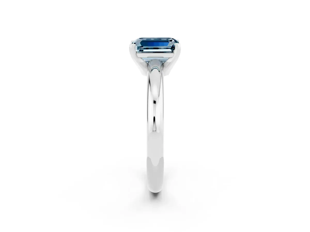 Emerald Cut Aquamarine Solitaire Engagement Ring with Round Band and Four-Prong Setting Silver
