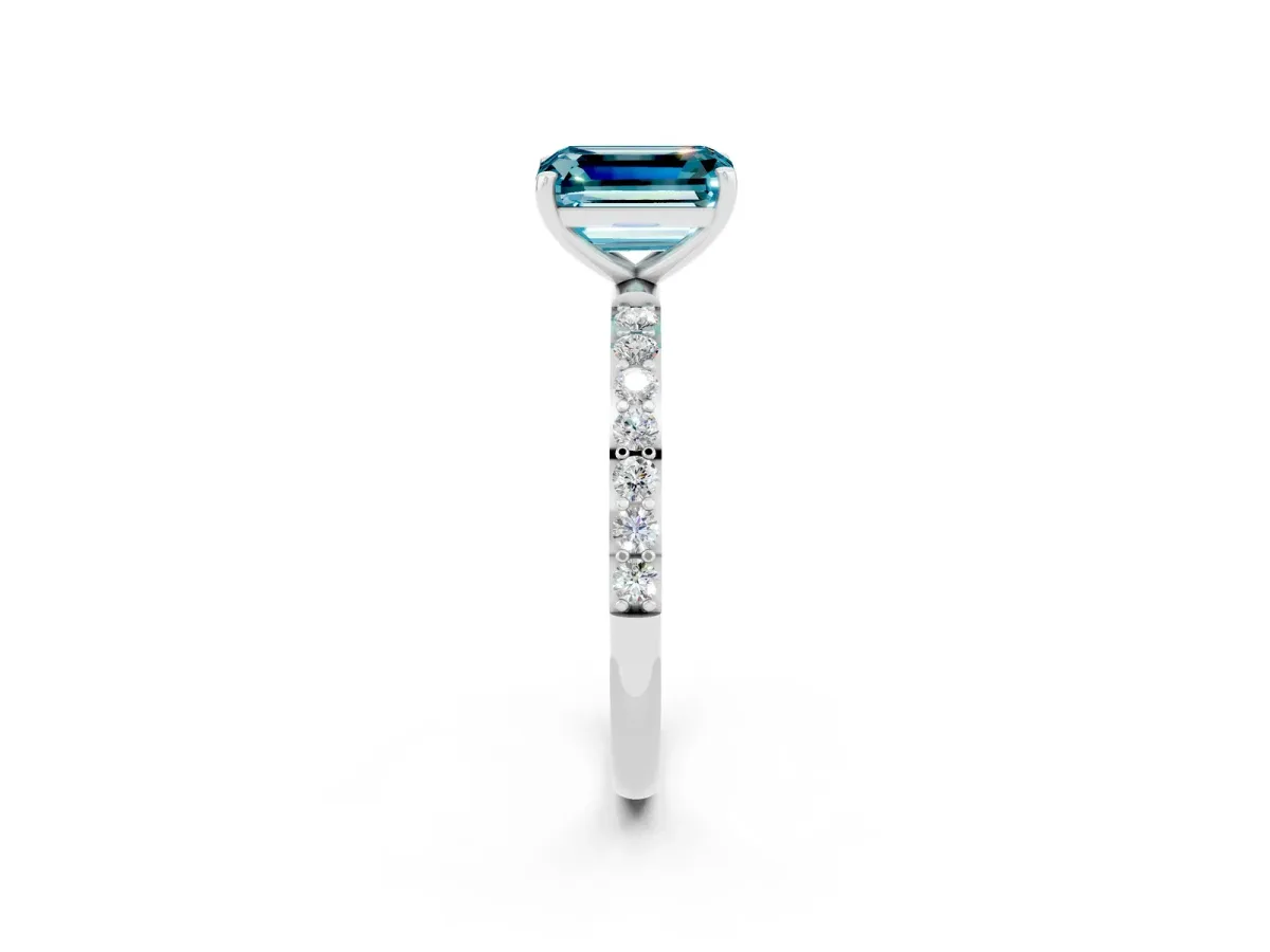 Emerald Cut Blue Topaz Solitaire Ring with Round Pavé Band and Prong Setting Platinum