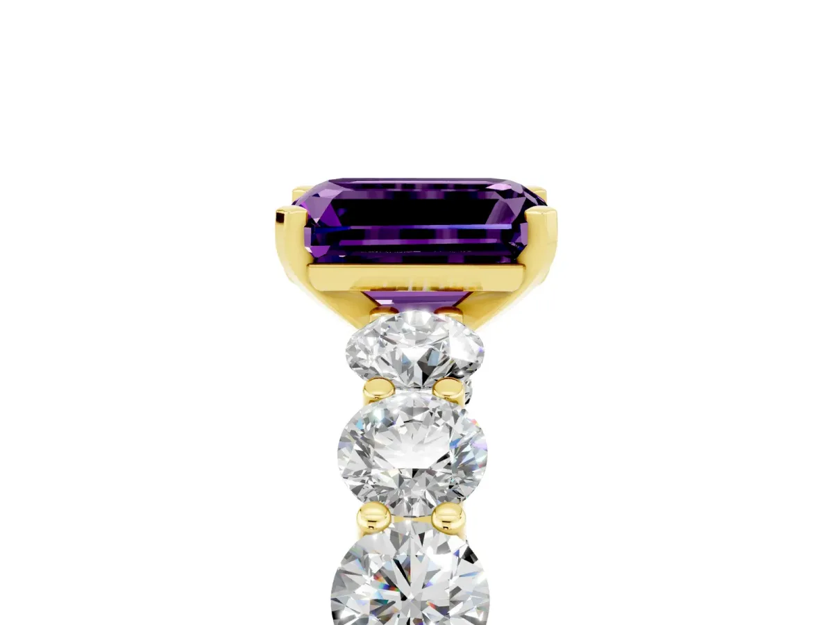 Emerald Cut Amethyst Prong Setting with Side Stones on a Pave Band Yellow gold