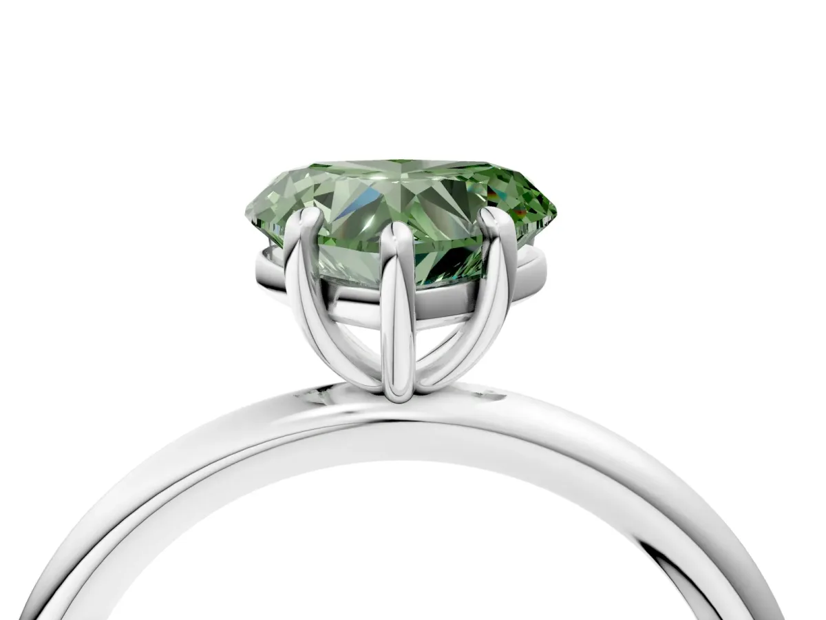 Fancy Green Heart Cut Solitaire Diamond Ring with Four-Prong Setting on a Plain Band Platinum
