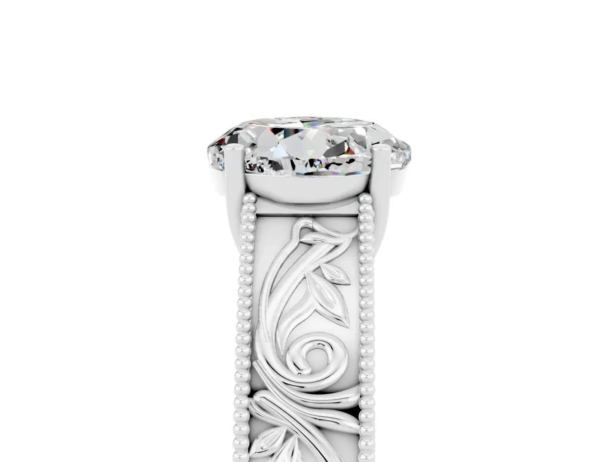 Round Cut Moissanite Solitaire Ring with Engraved Band and Four-Prong Setting White gold