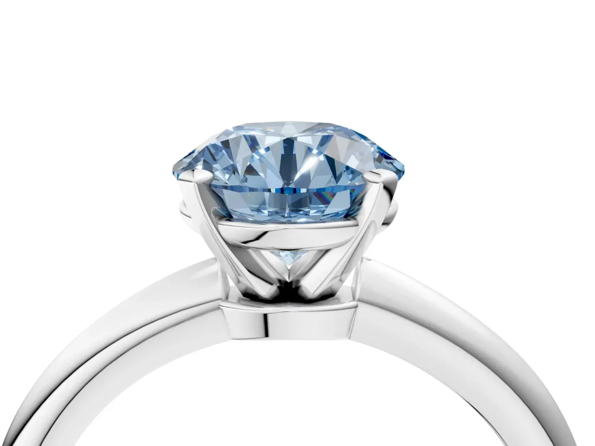 Fancy Blue Round Cut Diamond Solitaire Ring with Six-Prong Setting and Classic Band Platinum